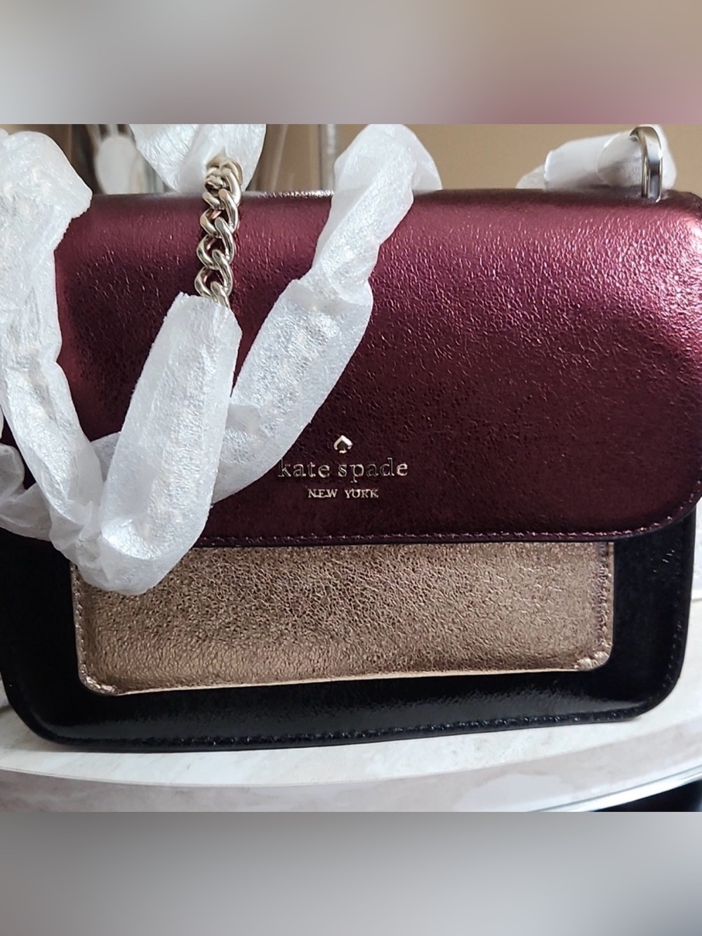 Kate Spade black, Burgundy and Gold Crossbody Bag. Metallic.